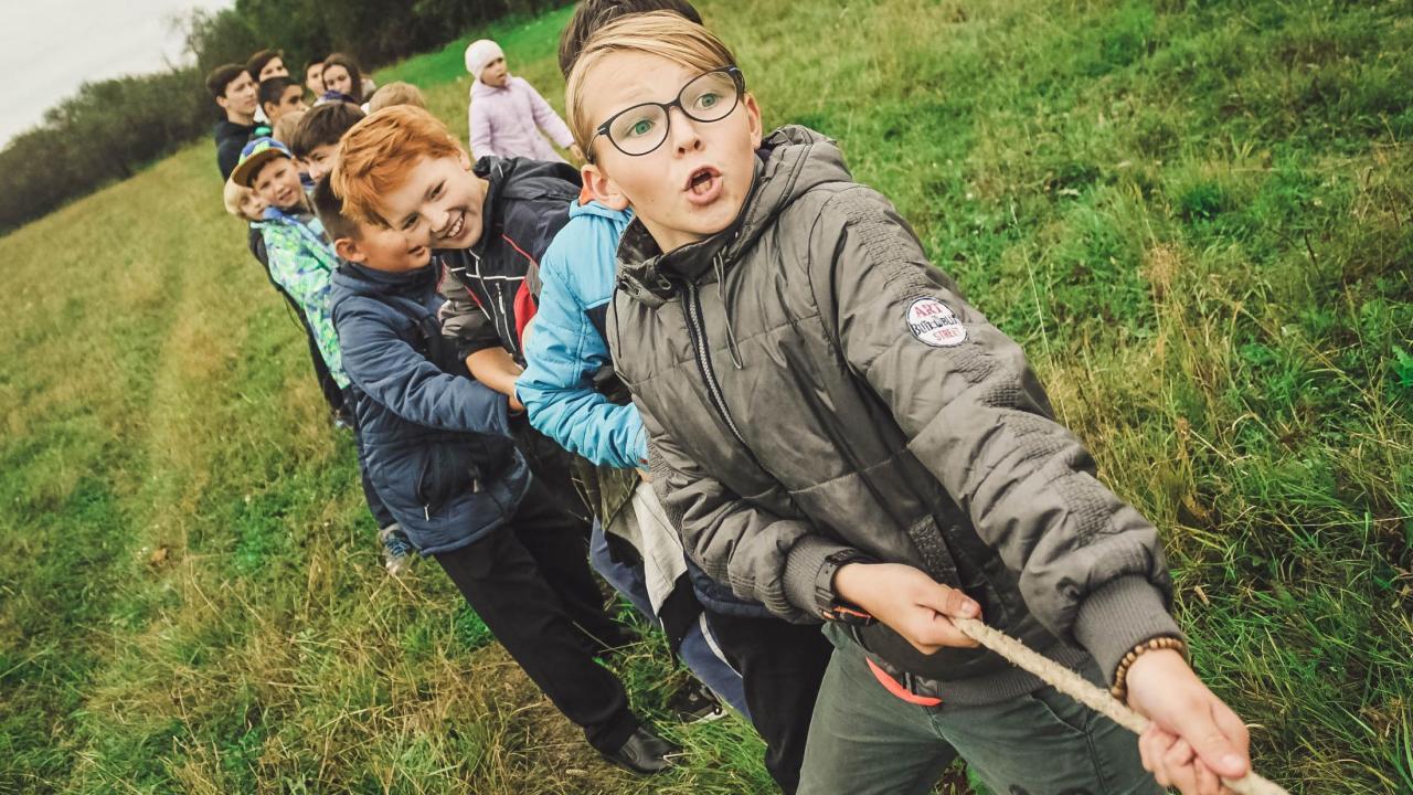 children playing tug of war