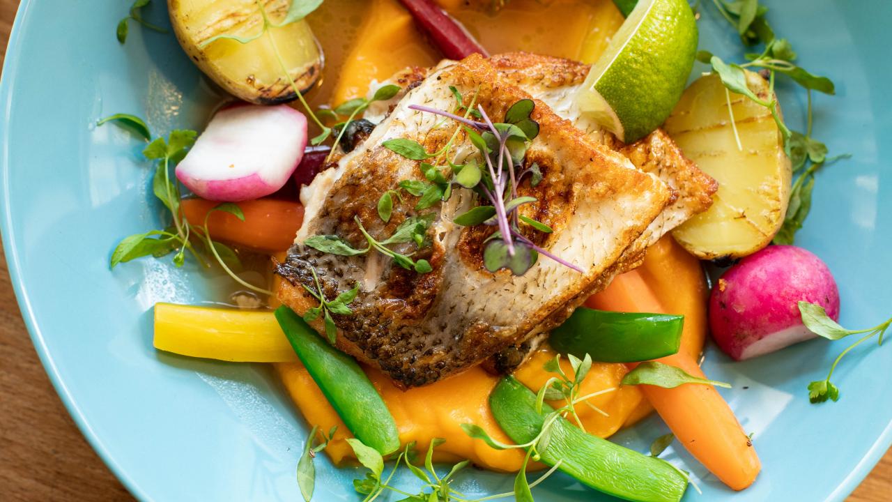 a plate of fish and vegetables