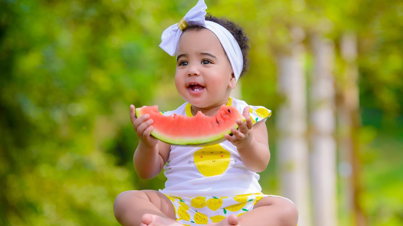 child eating watermelon