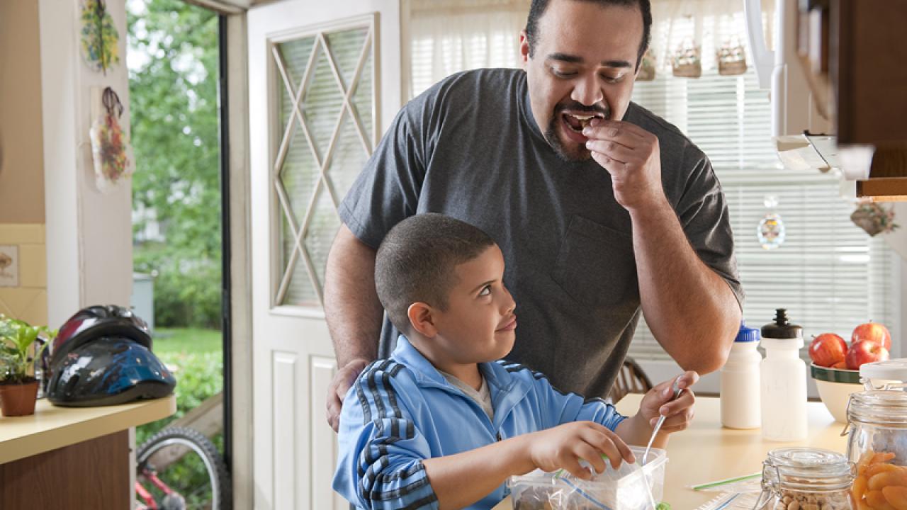 father and son packing snacks