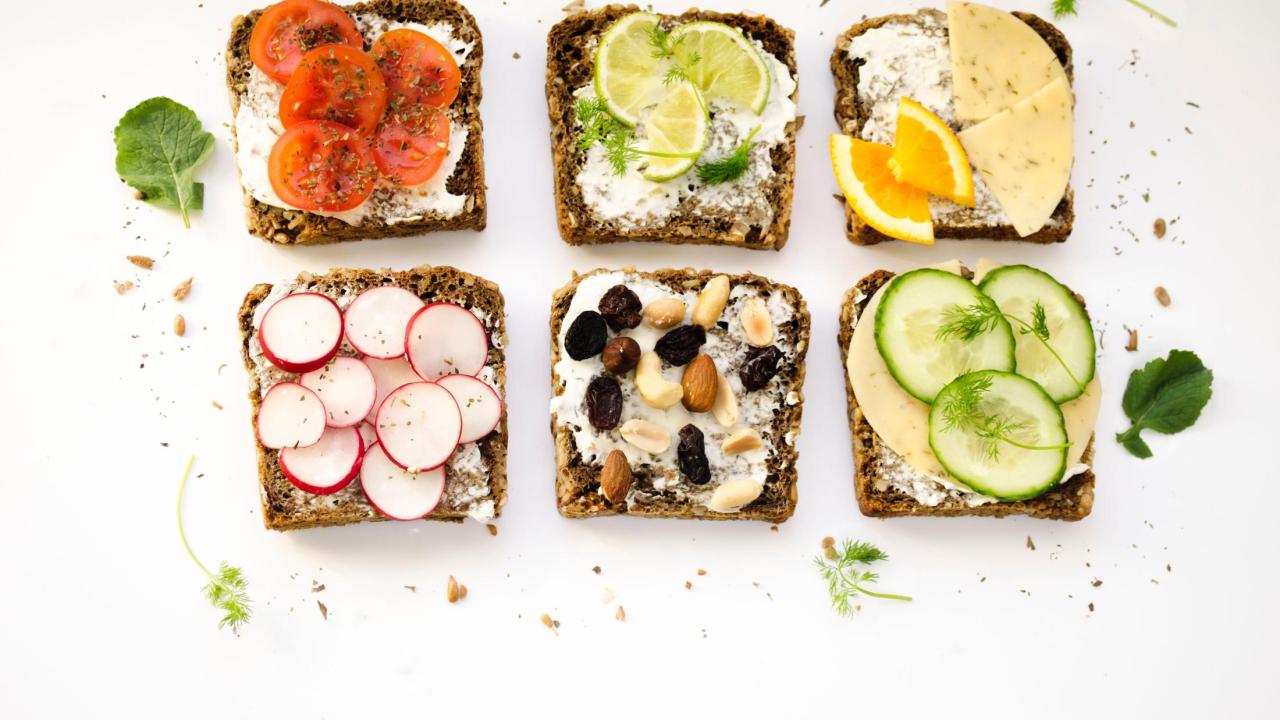 slices of bread topped with various fruit and vegetable toppings