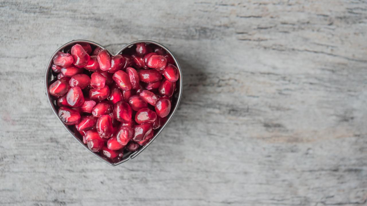 pomegranate seeds in the shape of a heart
