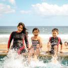 Family playing together in the water