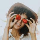 women holding strawberries 