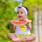 child eating watermelon