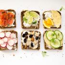 slices of bread topped with various fruit and vegetable toppings