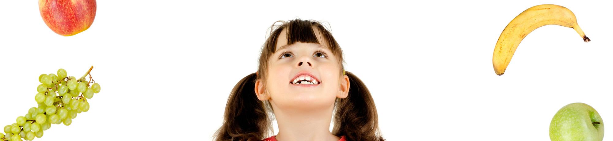 Girl looking at fruits.